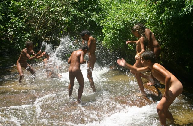 Nudists of Brazil on the small river