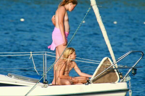 Nudists float a family on the yacht