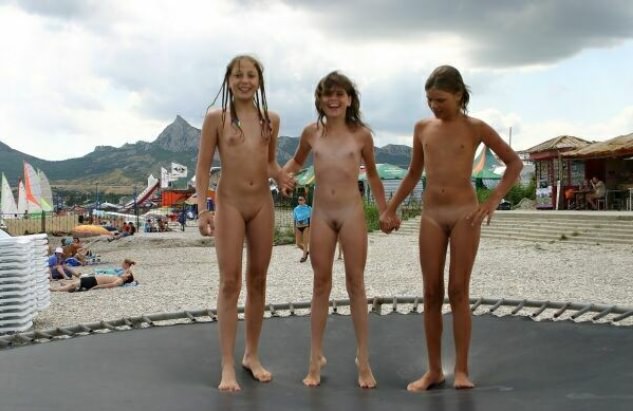 Nudists of the girl play on a beach