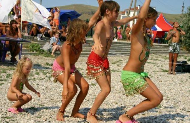 Family nudism on a beach - dances and competitions