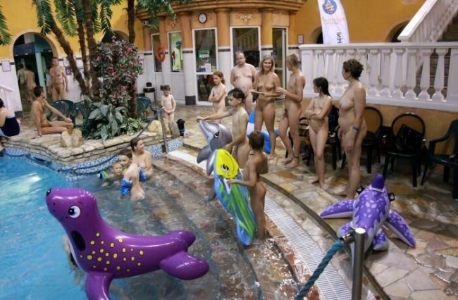 Modern nudism in the pool - series Indoor Waterside Day