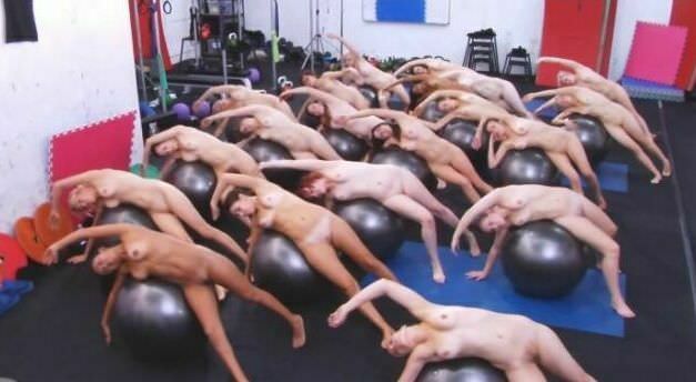 The big group of girls of nudists is engaged in aerobics in the sports hall - Purenudism video